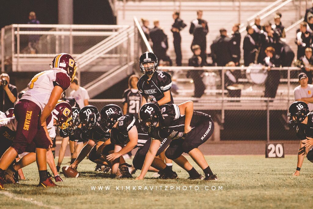 high school football photography trojans vs raiders